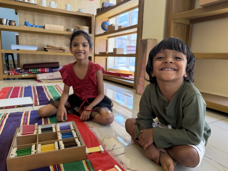 Child learning with wooden blocks and train toy